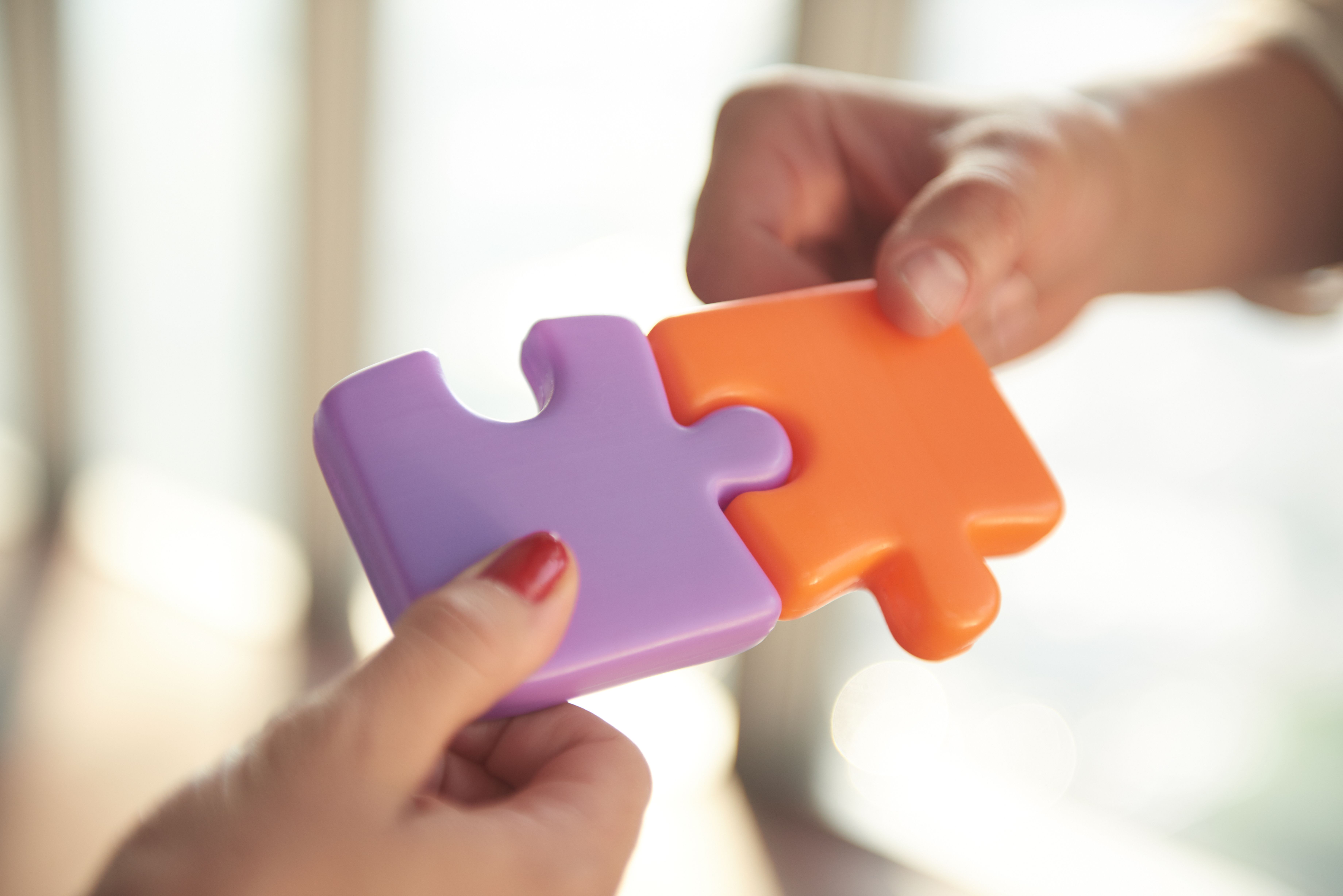 business-people-group-assembling-jigsaw-puzzle-and-represent-team-support-and-help-con-SBI-322393134