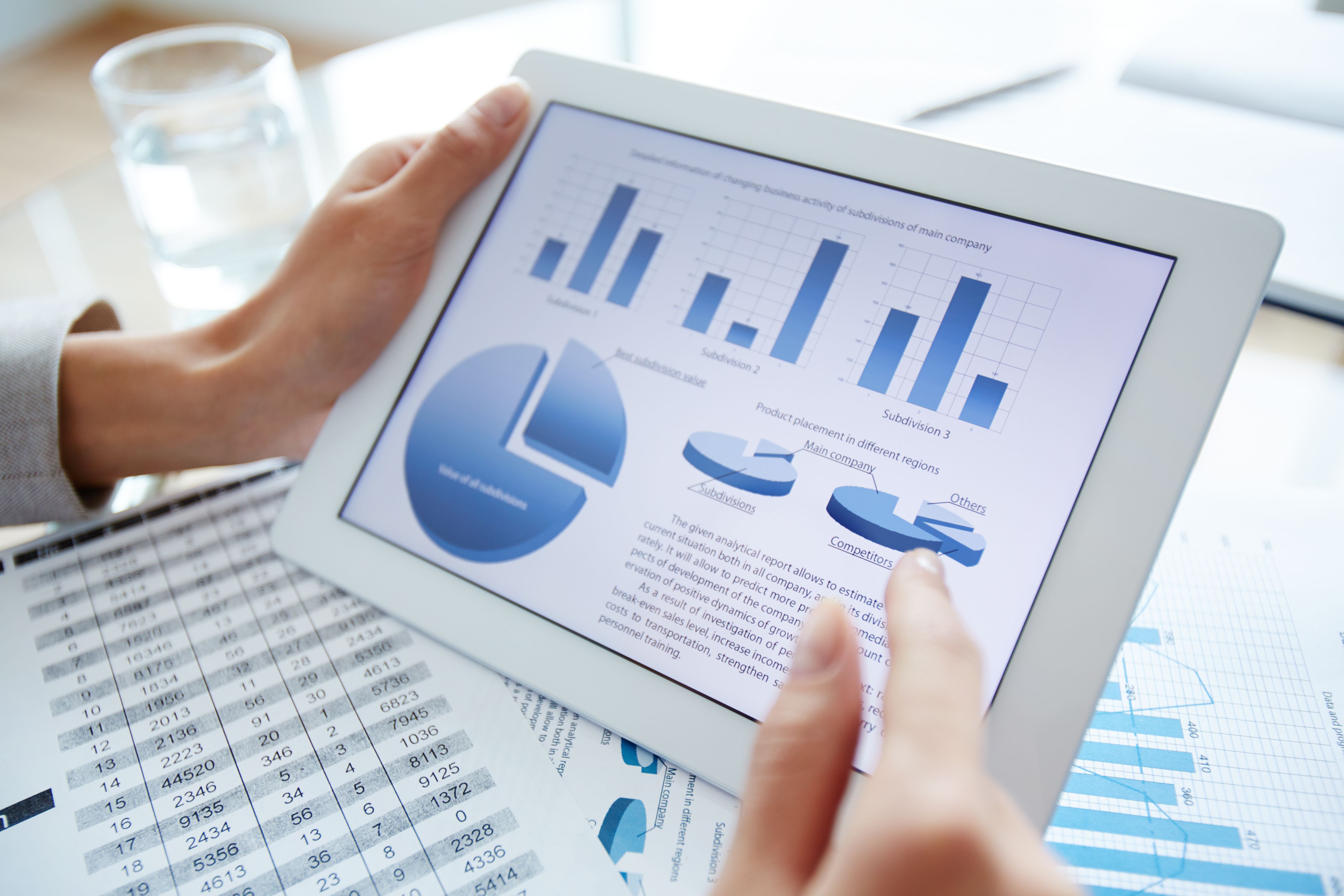 marketing-data-in-digital-tablet-and-female-hand-over-it-SBI-305401259